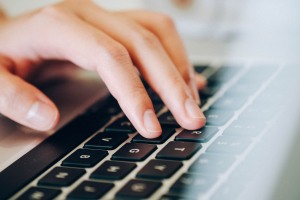 person typing on a keyboard